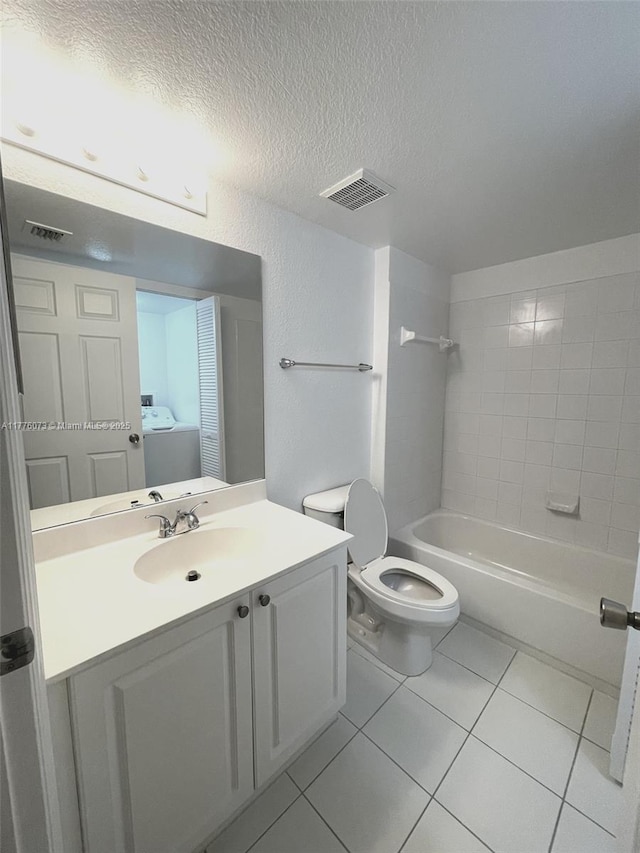 full bath featuring tile patterned floors, toilet, vanity, a textured ceiling, and visible vents