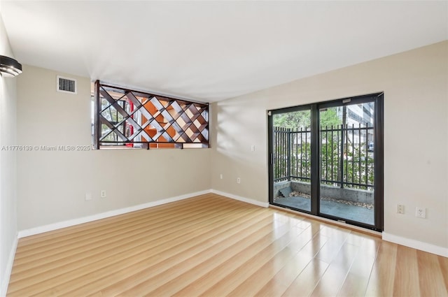 400 Valencia Ave Unit 2, Coral Gables, FL 33134 - spare room featuring wood finished floors and baseboards