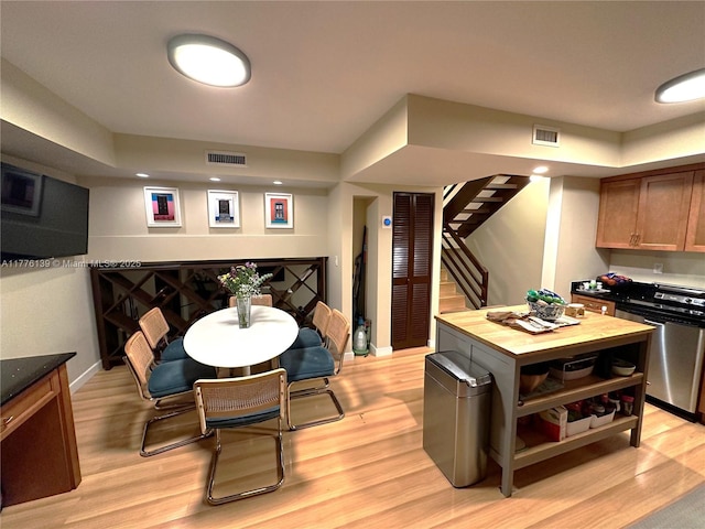 400 Valencia Ave Unit 2, Coral Gables, FL 33134 - dining area featuring stairway, light wood-type flooring, and baseboards