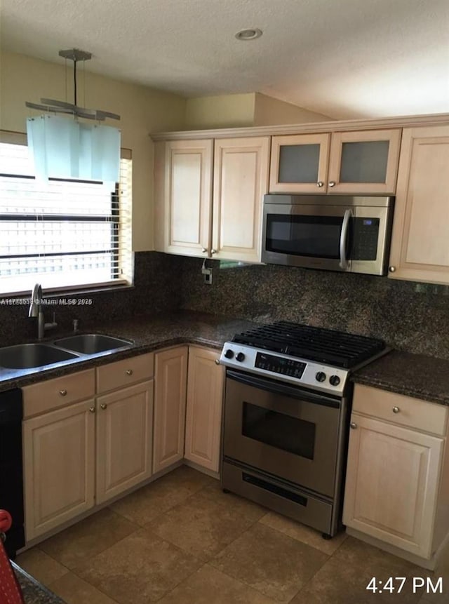 10420 SW 160th Ct, Miami, FL 33196 - kitchen featuring a sink, tasteful backsplash, dark countertops, and stainless steel appliances