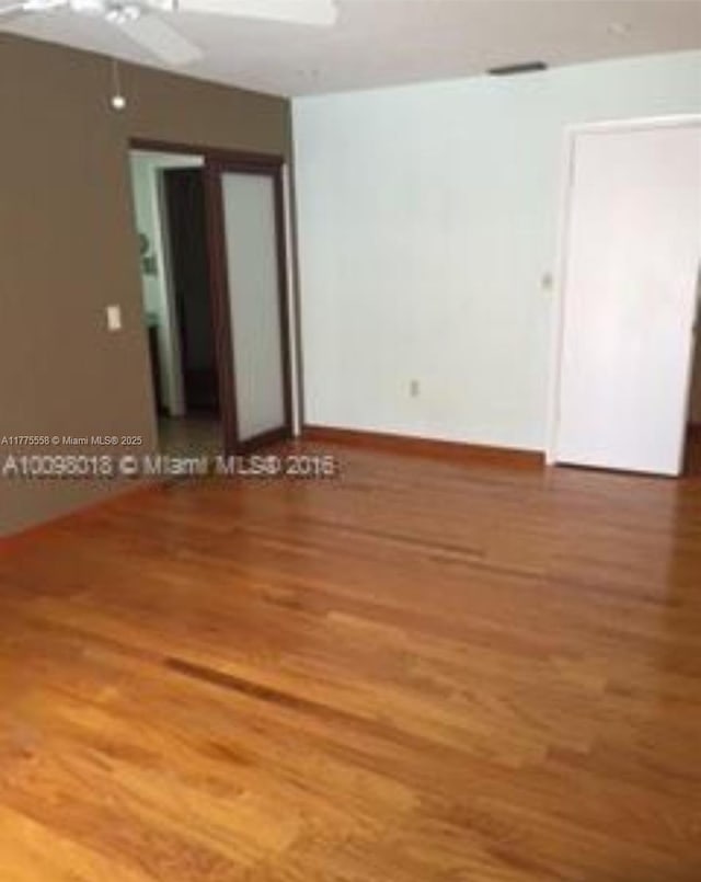 10420 SW 160th Ct, Miami, FL 33196 - spare room with ceiling fan and wood finished floors