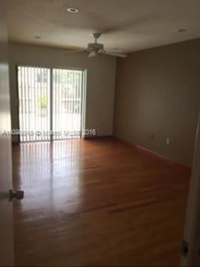 10420 SW 160th Ct, Miami, FL 33196 - spare room with wood finished floors and a ceiling fan