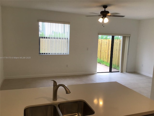 11378 SW 254th Ter, Homestead, FL 33032 - kitchen featuring a wealth of natural light, tile patterned flooring, a sink, and a ceiling fan