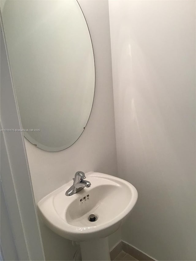 11378 SW 254th Ter, Homestead, FL 33032 - bathroom with baseboards and a sink