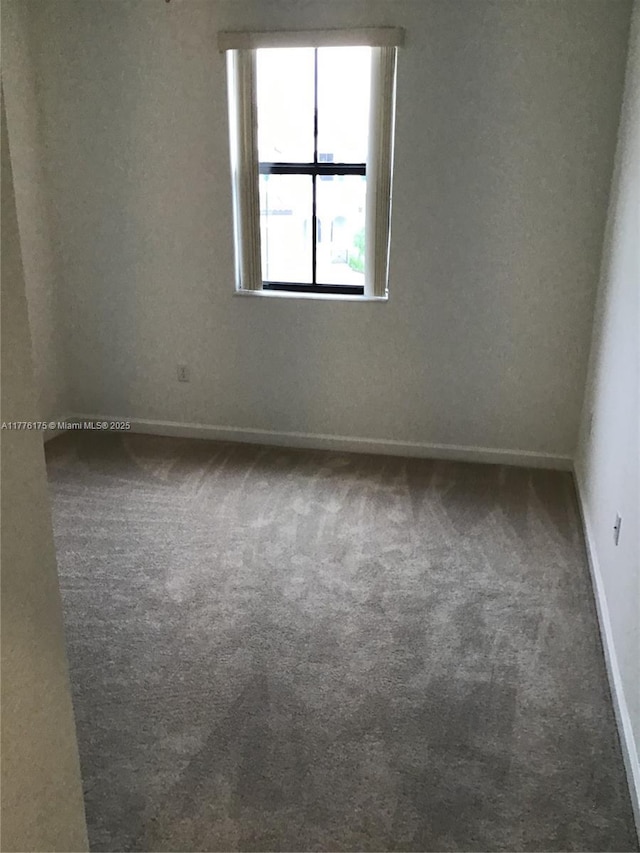 11378 SW 254th Ter, Homestead, FL 33032 - unfurnished room featuring baseboards and carpet