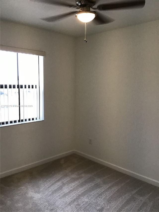 11378 SW 254th Ter, Homestead, FL 33032 - empty room featuring baseboards, dark carpet, and a ceiling fan