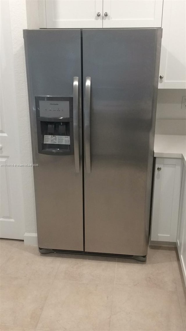 11378 SW 254th Ter, Homestead, FL 33032 - interior details featuring white cabinetry, stainless steel refrigerator with ice dispenser, and light countertops