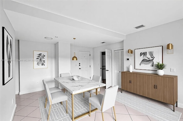 2280 SW 32nd Ave Unit 305, Miami, FL 33145 - dining area featuring light tile patterned flooring and baseboards