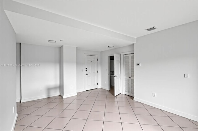 2280 SW 32nd Ave Unit 305, Miami, FL 33145 - spare room featuring baseboards and light tile patterned flooring