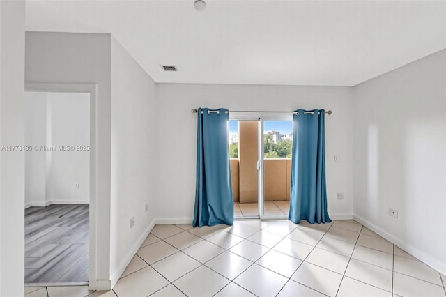 2280 SW 32nd Ave Unit 305, Miami, FL 33145 - unfurnished room featuring baseboards and light tile patterned floors