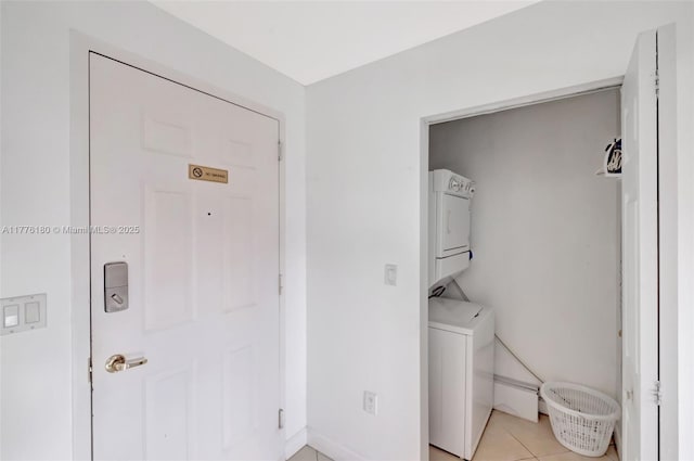 2280 SW 32nd Ave Unit 305, Miami, FL 33145 - laundry room featuring estacked washer and dryer and light tile patterned flooring