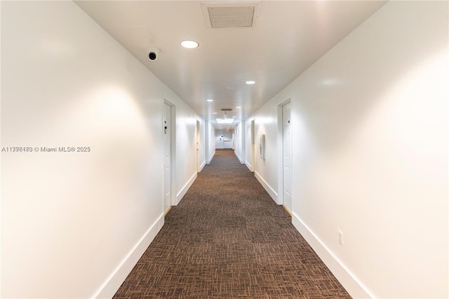 2280 SW 32nd Ave Unit 305, Miami, FL 33145 - hallway featuring recessed lighting, dark colored carpet, and baseboards
