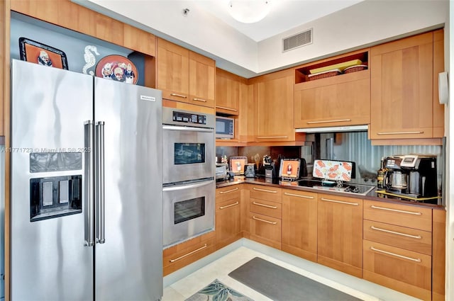 kitchen with open shelves, exhaust hood, dark countertops, visible vents, and appliances with stainless steel finishes