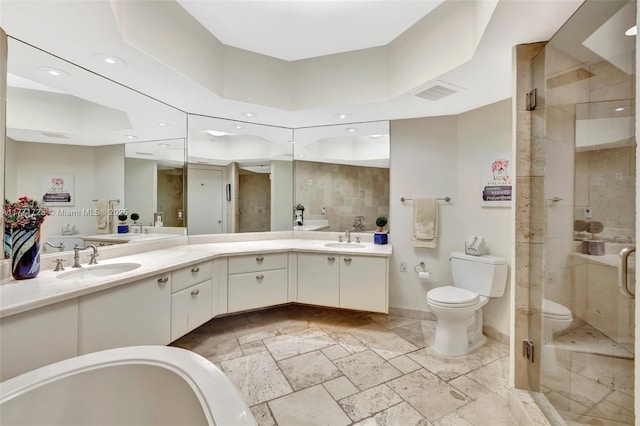 full bath with vanity, recessed lighting, toilet, a shower stall, and stone tile flooring