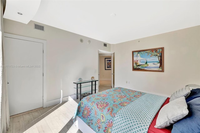 333 Las Olas Way Unit 1007, Fort Lauderdale, FL 33301 - bedroom featuring baseboards and light wood finished floors