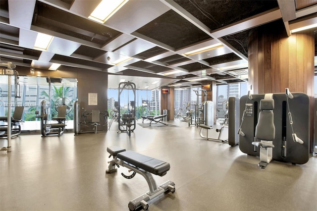 gym with a wall of windows, a view of city, and a wealth of natural light