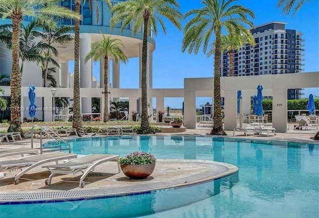 community pool with a patio area