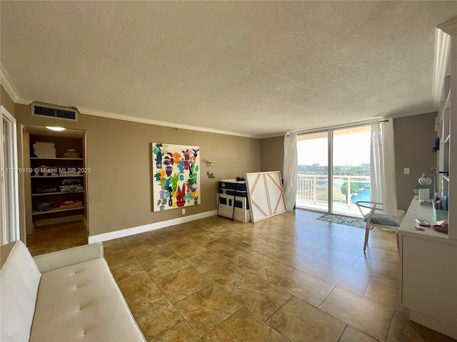 unfurnished living room featuring visible vents, baseboards, a wall of windows, a textured ceiling, and crown molding