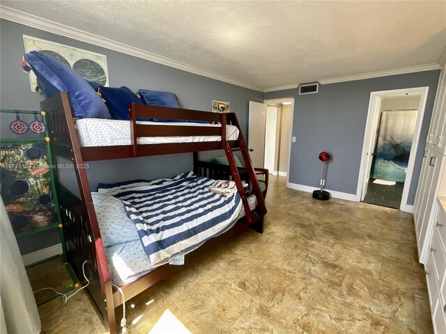 437 Golden Isles Dr Unit 9B-C, Hallandale Beach, FL 33009 - bedroom featuring crown molding, a textured ceiling, and baseboards