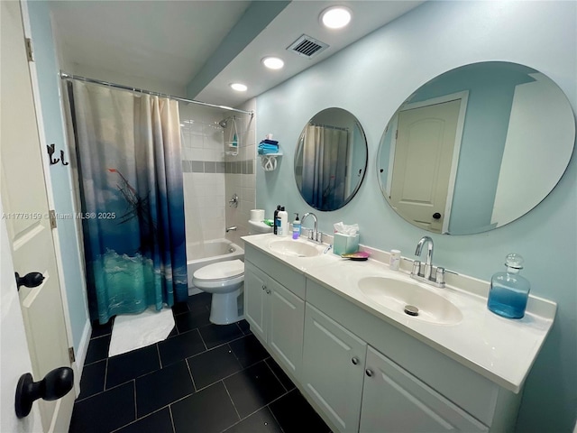 bathroom featuring shower / bath combo, double vanity, a sink, and visible vents