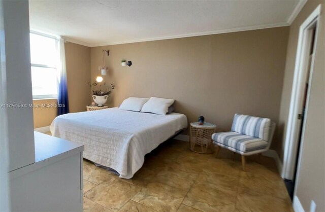 437 Golden Isles Dr Unit 9B-C, Hallandale Beach, FL 33009 - bedroom featuring crown molding