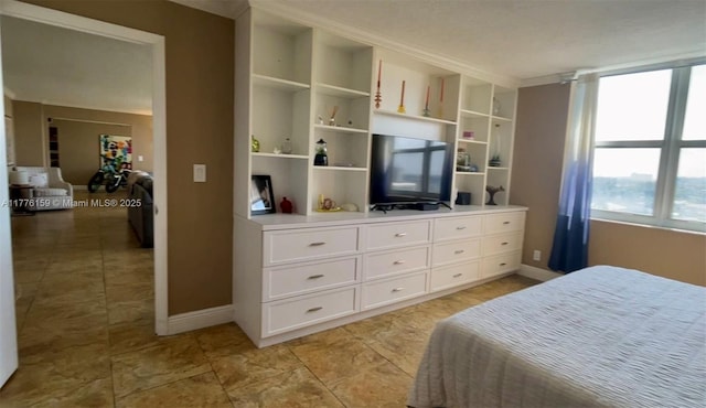 437 Golden Isles Dr Unit 9B-C, Hallandale Beach, FL 33009 - bedroom featuring baseboards