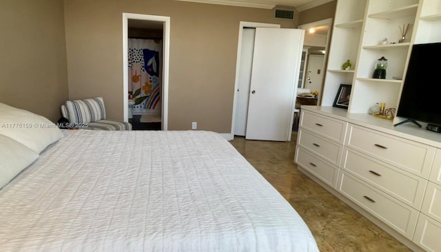 bedroom featuring crown molding, visible vents, and multiple closets