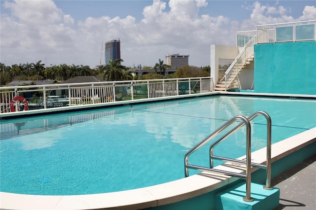 view of pool with stairway