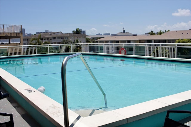 437 Golden Isles Dr Unit 9B-C, Hallandale Beach, FL 33009 - community pool with a residential view
