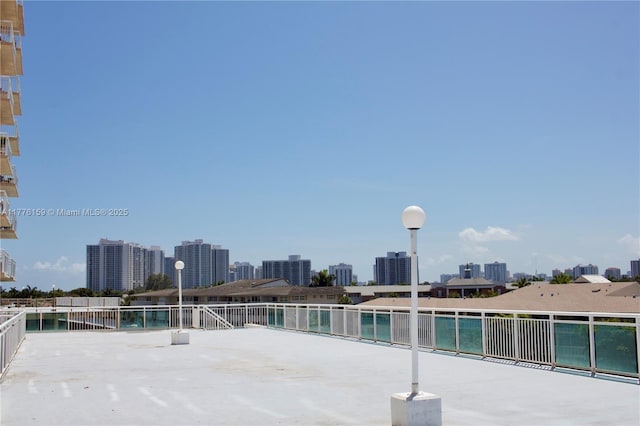 437 Golden Isles Dr Unit 9B-C, Hallandale Beach, FL 33009 - view of patio featuring a city view