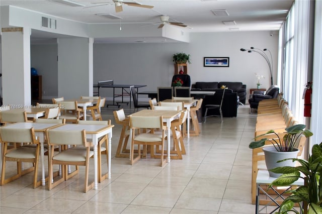 dining space featuring light tile patterned floors, visible vents, and a ceiling fan