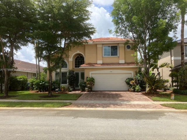 17794 SW 47th St, Miramar, FL 33029 - mediterranean / spanish-style home with a tiled roof, decorative driveway, stucco siding, and a garage