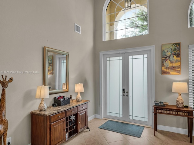 17794 SW 47th St, Miramar, FL 33029 - entrance foyer featuring a high ceiling, baseboards, french doors, and light tile patterned floors