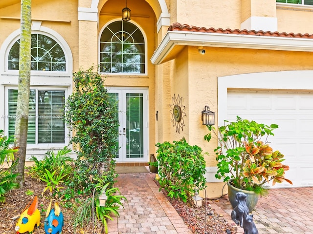 17794 SW 47th St, Miramar, FL 33029 - doorway to property with french doors, stucco siding, a garage, and a tiled roof