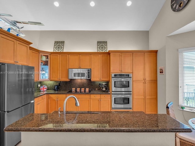 17794 SW 47th St, Miramar, FL 33029 - kitchen featuring stainless steel appliances, a sink, tasteful backsplash, a kitchen island with sink, and glass insert cabinets