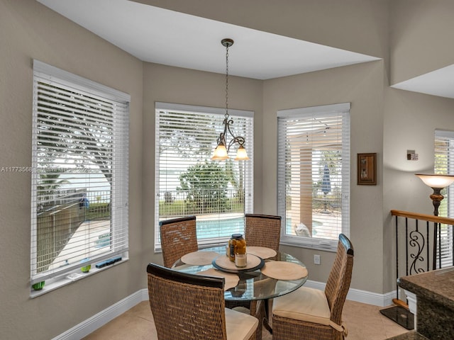 17794 SW 47th St, Miramar, FL 33029 - dining area featuring baseboards, healthy amount of natural light, and light tile patterned flooring
