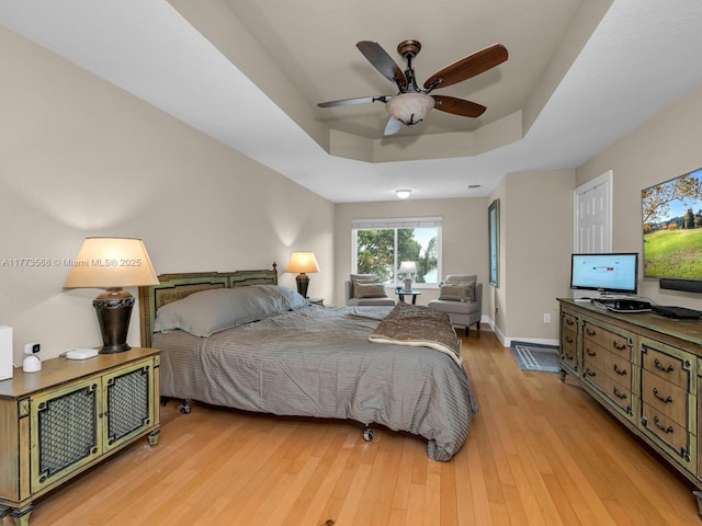 17794 SW 47th St, Miramar, FL 33029 - bedroom featuring a tray ceiling, wood finished floors, and baseboards
