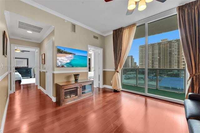 1945 S Ocean Dr Unit 604, Hallandale Beach, FL 33009 - unfurnished living room with a ceiling fan, wood finished floors, and crown molding