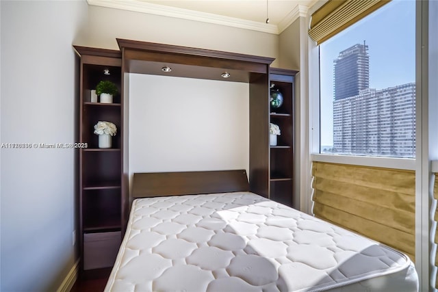 bedroom featuring crown molding