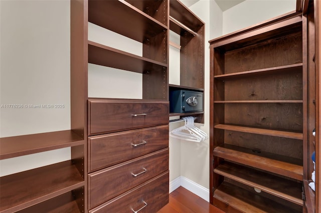 1945 S Ocean Dr Unit 604, Hallandale Beach, FL 33009 - walk in closet featuring dark wood finished floors