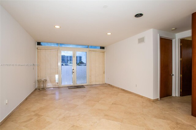 4750 SW 43rd Ave, Dania Beach, FL 33314 - spare room featuring carpet floors, a ceiling fan, french doors, and baseboards