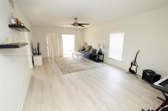 2700 Casita Way Unit 2150, Delray Beach, FL 33445 - living room featuring light wood-style flooring, ceiling fan, plenty of natural light, and baseboards
