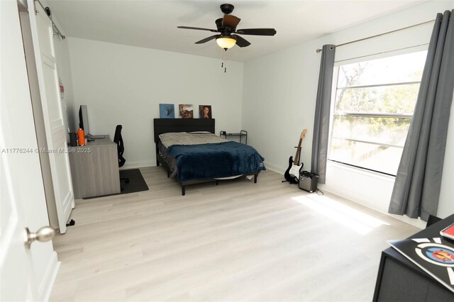 2700 Casita Way Unit 2150, Delray Beach, FL 33445 - bedroom with light wood-style floors, baseboards, and a ceiling fan