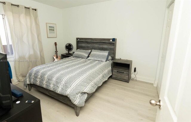 2700 Casita Way Unit 2150, Delray Beach, FL 33445 - bedroom with wood finished floors and baseboards
