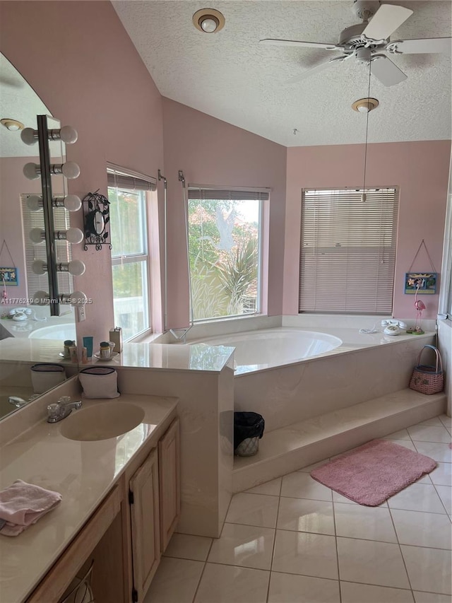 721 Spring Lake Dr, Melbourne, FL 32940 - full bathroom featuring ceiling fan, a textured ceiling, a tub, vanity, and lofted ceiling