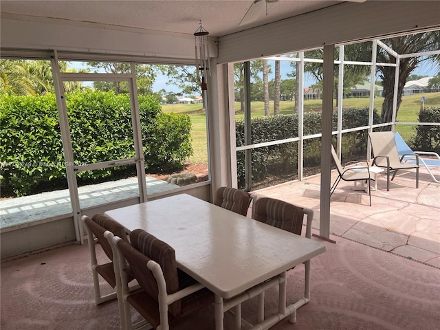 721 Spring Lake Dr, Melbourne, FL 32940 - sunroom / solarium featuring outdoor dining space