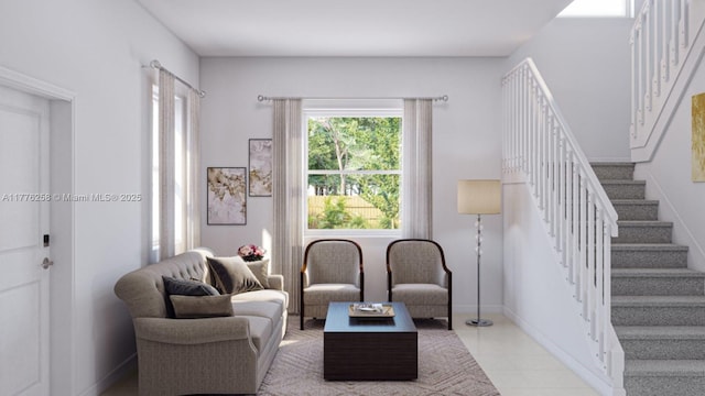 living area with light tile patterned floors, baseboards, and stairs