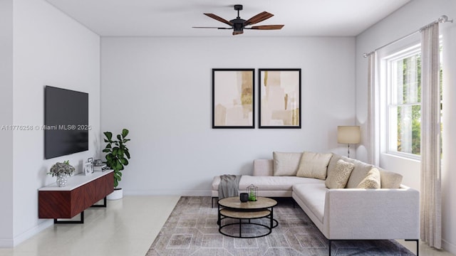living room featuring a ceiling fan and baseboards