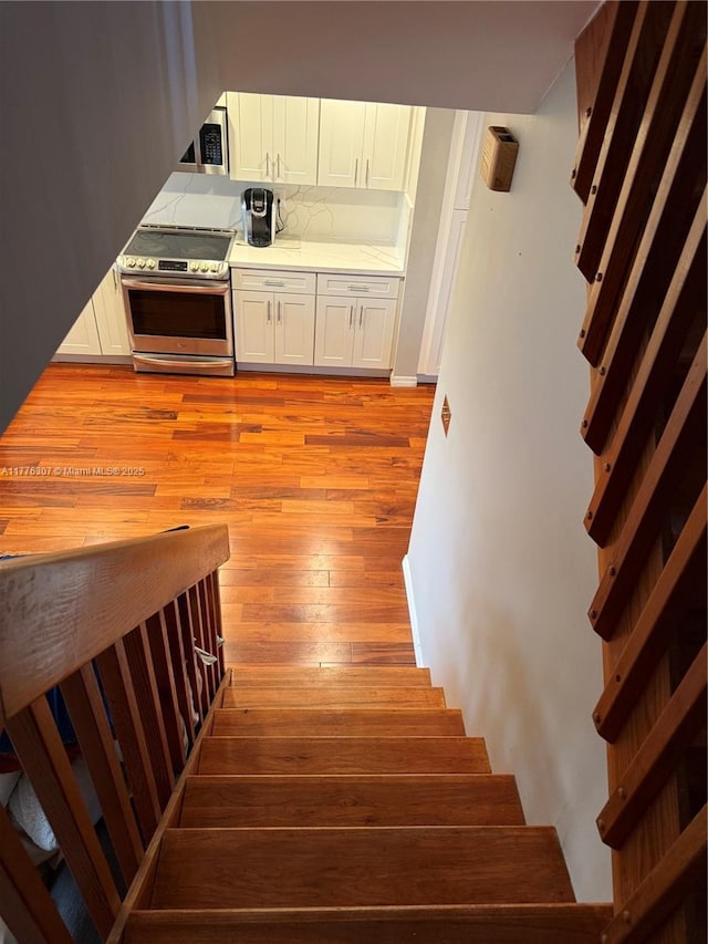 2912 NW 80th Ave, Sunrise, FL 33322 - stairs featuring wood-type flooring