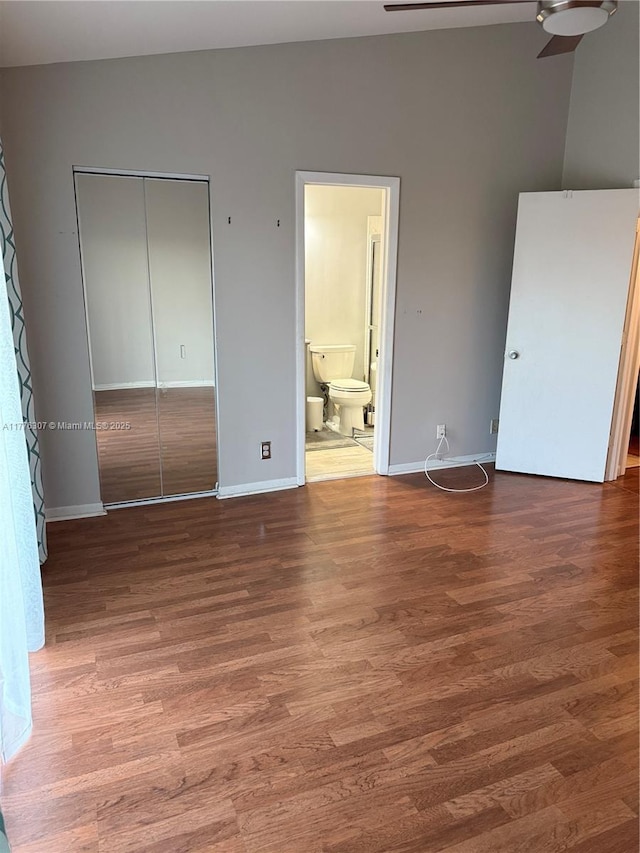 2912 NW 80th Ave, Sunrise, FL 33322 - unfurnished bedroom featuring wood finished floors, a closet, and baseboards